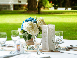 View of a floral place setting featuring for an outdoor wedding reception at Hopsewee Plantation. Photo by Alan Sherlock.