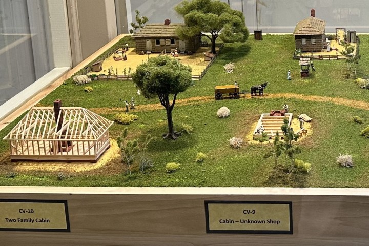 a person sitting on display in a garden