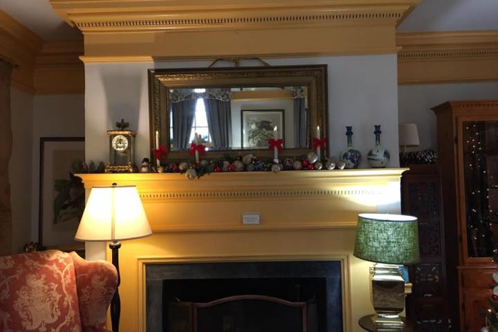 a flat screen tv sitting in a living room with a fireplace