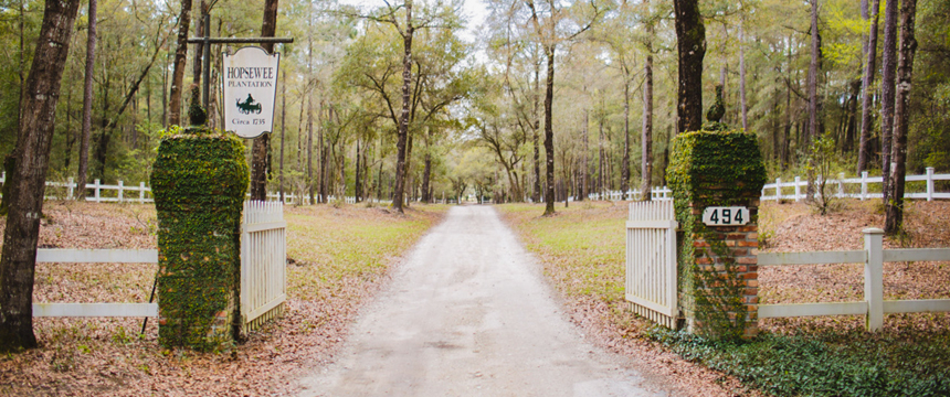 a sign on a dirt path in a park