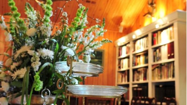 a vase of flowers on a dining room table
