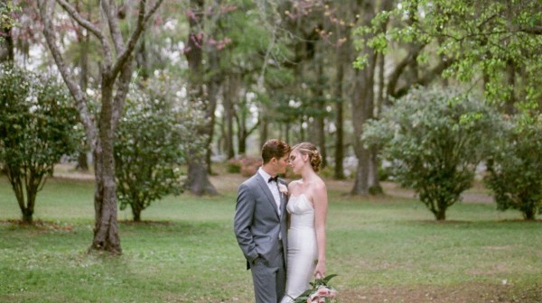 a person that is standing in the grass