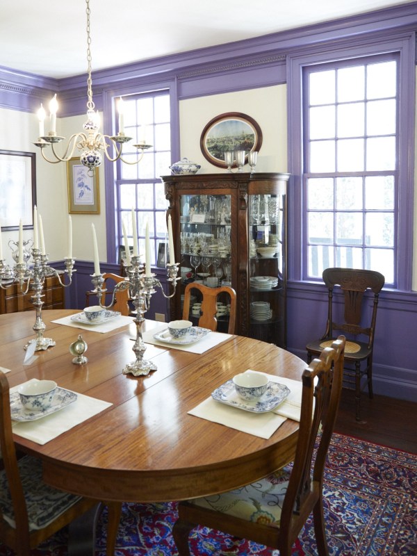 a dining room table in front of a window