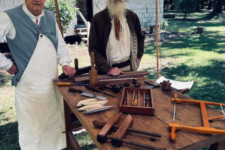 a person sitting at a picnic table